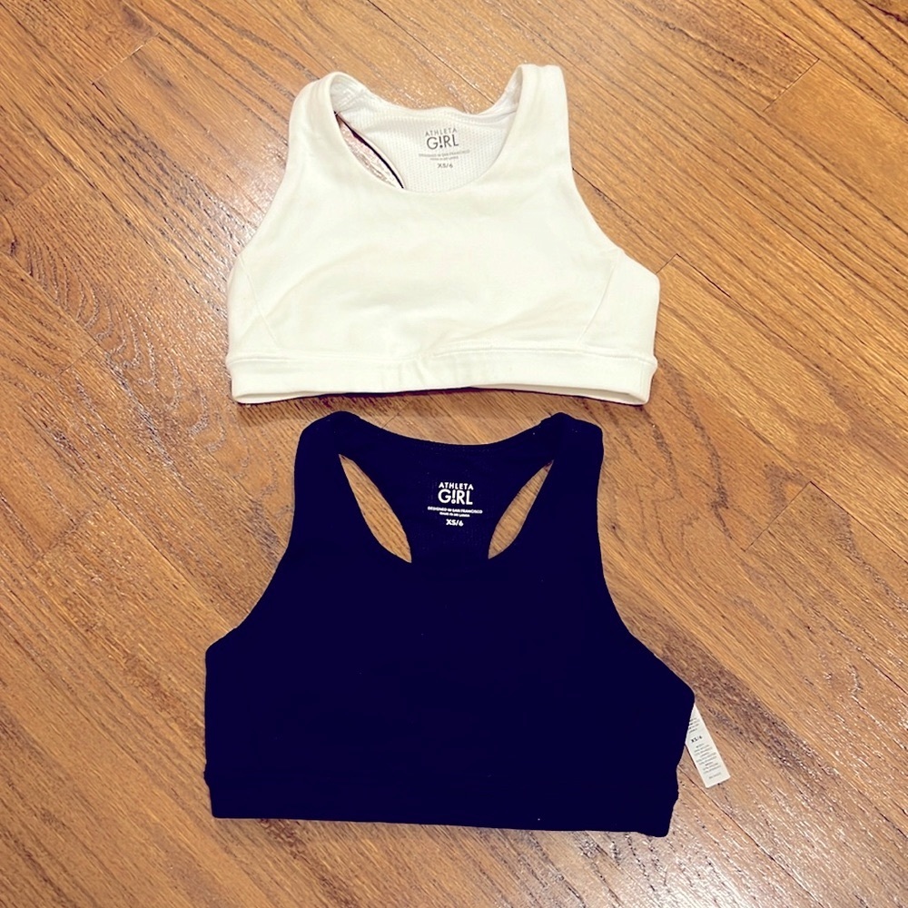 2 Athleta Girls sports bras- size XS/6- one black, one white- worn once